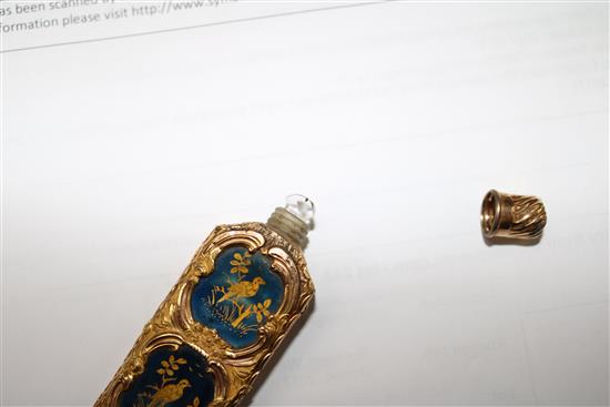 An early 20th century continental gold overlaid enamelled glass scent bottle, 75mm.